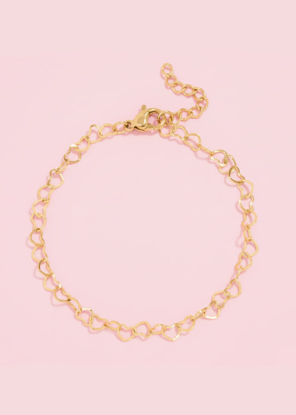 Gold chain bracelet on a white background