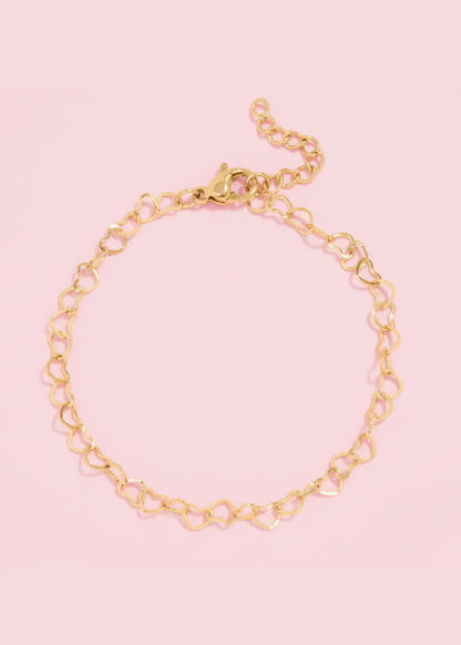 Gold chain bracelet on a white background