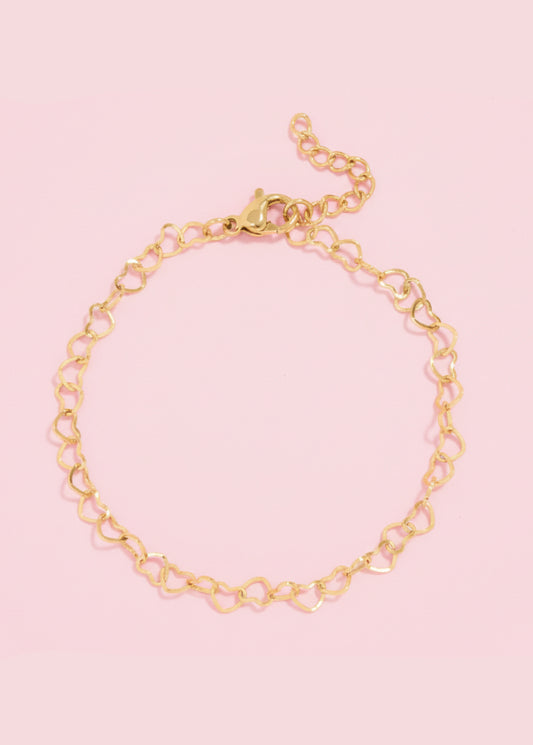 Gold chain bracelet on a white background